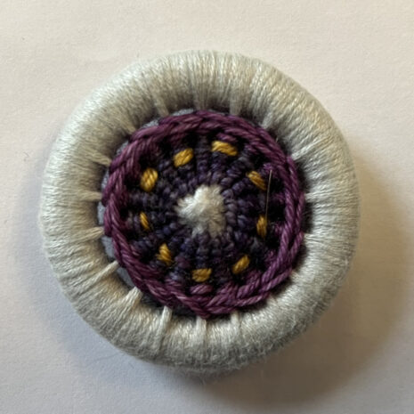 Dorset button needle keeper